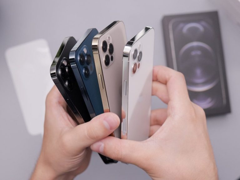 person holding white and black iphone case