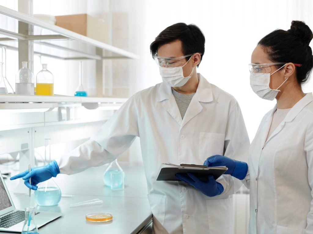 Two Scientists Working Inside the Laboratory