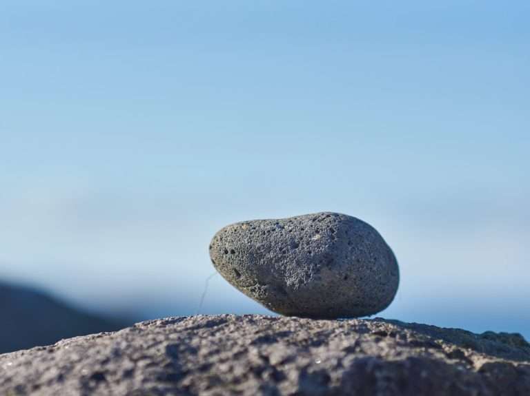 gray stone on brown soil during daytime