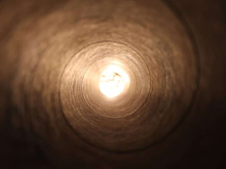 closeup photo of tunnel with lighted light