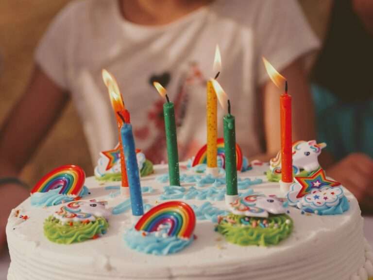 unicorn rainbow Birthday cake with five assorted-color candles